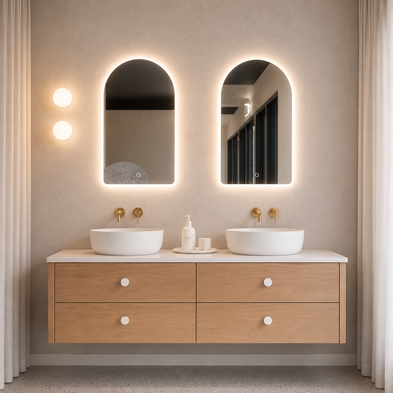 Bathroom vanity with two white sinks, wooden cabinets, and illuminated mirrors.